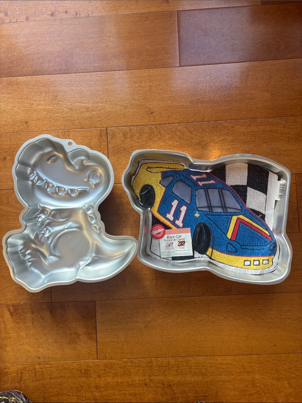 Set of 2 Wilton Cake Pans Kids Race Car and Dino Dinosaur